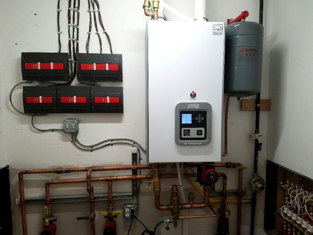 https://www.aquinoplumbing.com/wp-content/uploads/2019/09/Boiler-by-Triangle-Tube.jpg